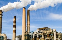 factory producing pollution from towers