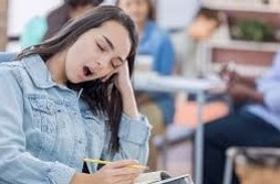 Sleeping teen in class