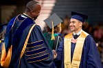 Grad shaking hand of Provost