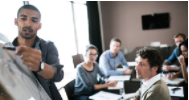 Group meeting with man at whiteboard