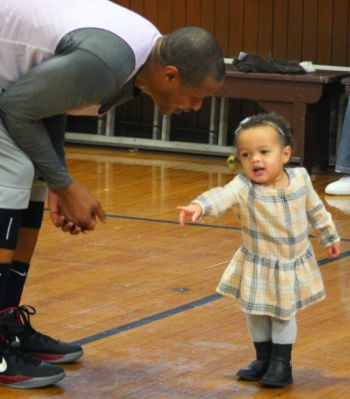 Basketball player with a young girl