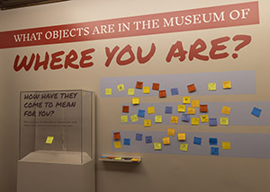 installation view of Museum of Where We Are with post-it interactive wall