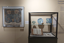 display cases in Gateway exhibition with Morris textile and ceramics